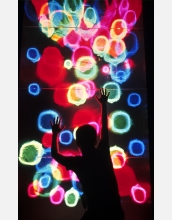 A child inspects the "Wall of Lights" exhibit at the San Francisco Exploratorium