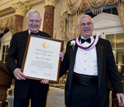 NSB Awards Chairman Ray Bowen presents the 2010 Vannevar Bush Award to Bruce Alberts.