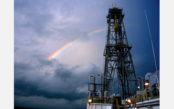 Raibow breaks clouds over <em>JOIDES Resolution</em> drillship