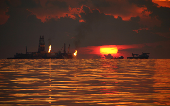 Natural gases flare while collected after Deepwater Horizon oil spill