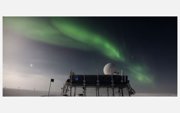 <em>Aurora borealis</em> in sky overtop Summit Station, Greenland