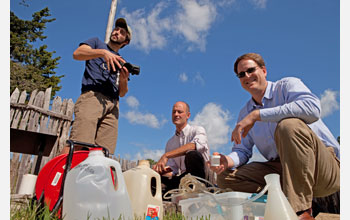 Geologists prepare to draw water from one of the wells used by the original colonists