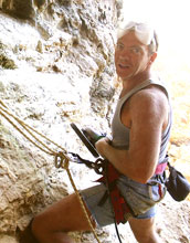 Curtis Marean collects geologic samples along coast in South Africa