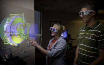 Students observe a 3D projection of an aircraft engine at the South Carolina ATE Center