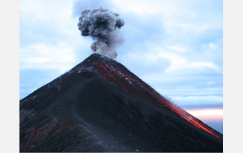 A small explosion from Fuego, an open vent volcano located 20 miles west of Guatemala City