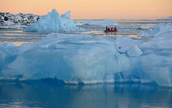 Palmer Station personnel navigating icebergs