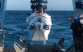 scientists pulling vehicle Alvin from the water