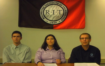 Student Jeremy Leakakos (left) and professors Stephanie Ludi and Thomas Reichlm discuss Project ACE.