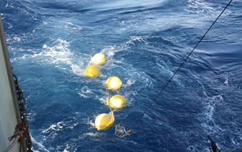 Photo of a current meter and chain of floats deployed as part of several-kilometers-long mooring.