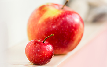 two apples on table