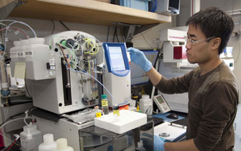 Photo of a researcher conducting a geochemical analysis of the water in ocean-floor sediments.