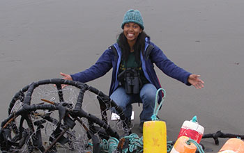 Young woman and fishing nets