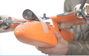 hands holding a drone with propellers