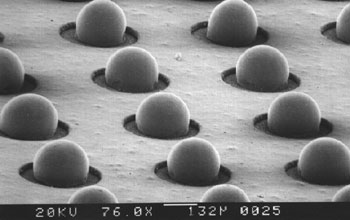 A ball grid array electronic component printed by electrostatic deflection of molten metal droplets