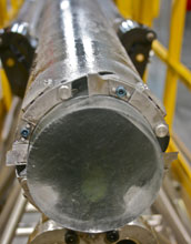 An ice core taken from the West Antarctic Ice Sheet Divide in its sampling barrel.