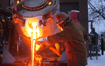 Man and volcanic material in a cylinder