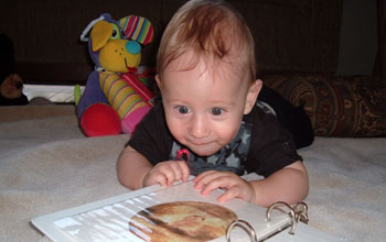 baby looking at a book