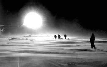 Researchers studying seals by light of research vessel <em>Laurence M. Gould</em>