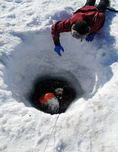 Diver re-emerges from waters of McMurdo Sound, Antarctica, after 30 minutes underwater