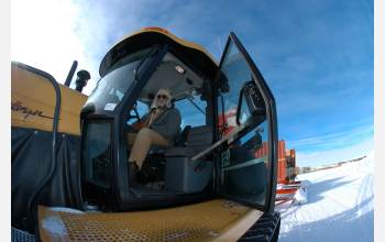 Traverse leader John Wright sits in a Cat Challenger 95 tractor.