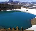 Photo of the Krafla volcano, Iceland, and drill rig across the explosion crater Viti.