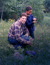 An adult/child team of participants in the Monarch Butterfly Larval Monitoring project