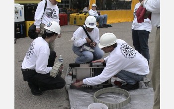 Researchers decontaminate robot.