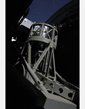 Photo of moonlight illuminating the 200-inch Hale Telescope at Palomar Observatory.