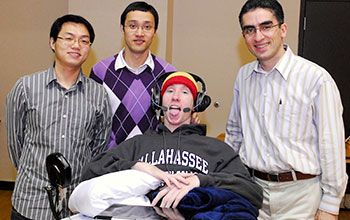 Cruise Bogle, center, poses with Georgia Tech researchers who developed the Tongue Drive system