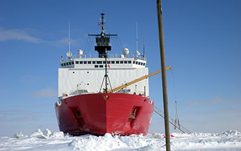 Alaskan native ice testing stick, called an "unghaq," can be seen protruding from the ice