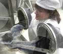 Photo of person processing meteorite.