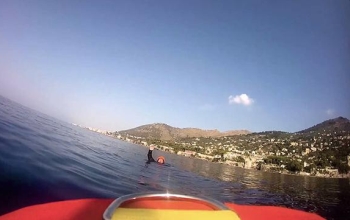 swimmer with hand up in open water