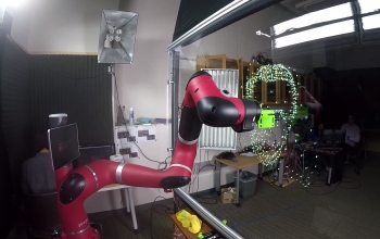 robot arm marking dots on glass