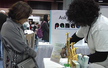 two females at a science exhibit