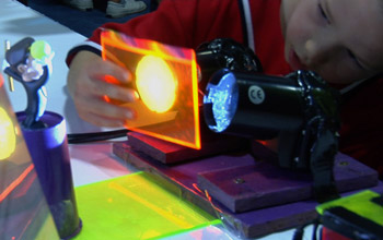 child with a laser exhibit at USA Science and Festival