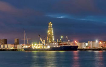 Photo of the night view of the JOIDES Resolution, docked in Auckland, New Zealand.