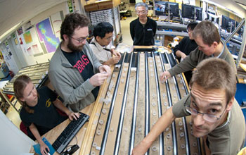 Photo of researchers working on the sediment cores.