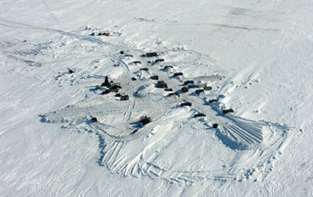 the camp and a road in the upper left on ice-covered Lake E.