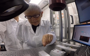 scientist pointing at equipment