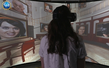 girl with vr glasses standiong in front of screen