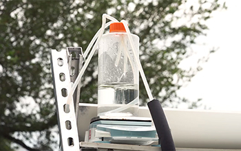 water inside of a bottle with a tube