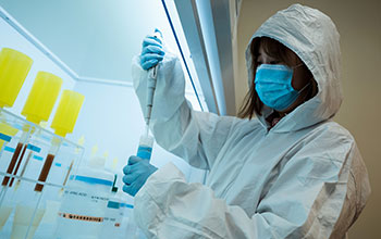 Graduate student Zhen Tian measures a sample in the lab